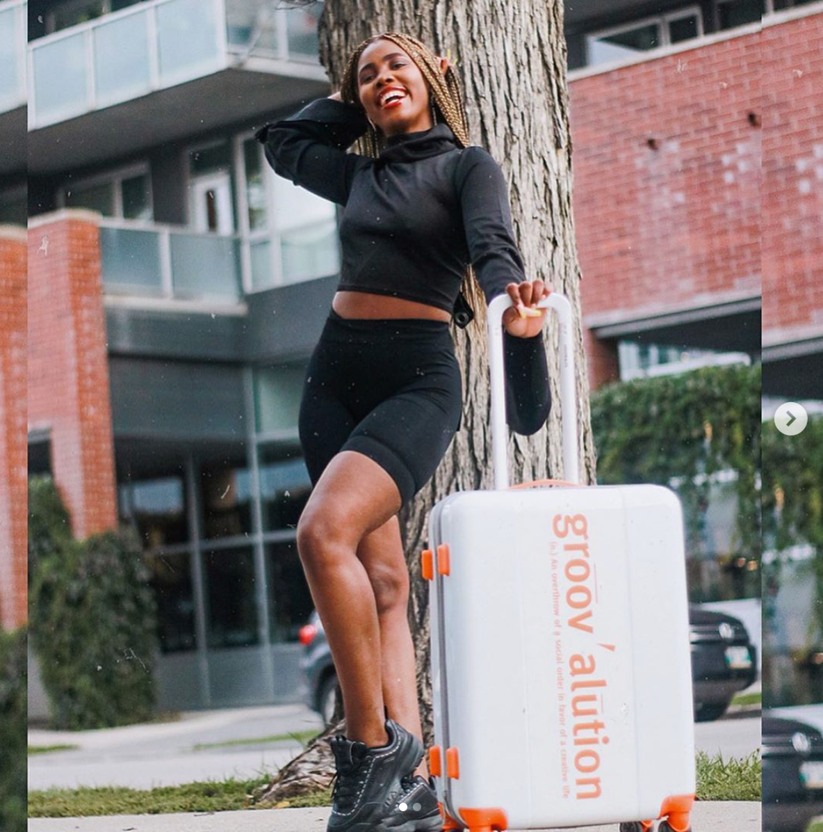 White & Orange Groovalution Suitcase